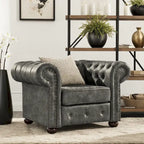 Fauteuil Chesterfield capitonné à accoudoirs volutes
