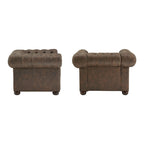 Fauteuil Chesterfield capitonné à accoudoirs volutes