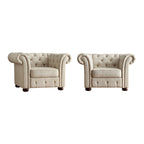 Fauteuil Chesterfield capitonné à accoudoirs volutes