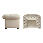 Fauteuil Chesterfield capitonné à accoudoirs volutes
